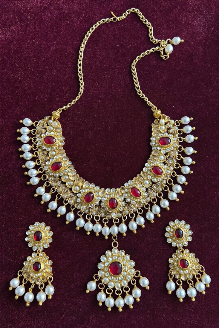 Kundan bridal choker set with earrings and tikka on velvet