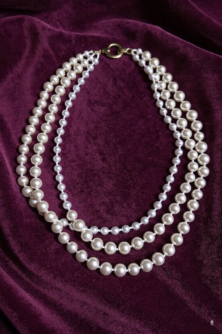 Three-strand faux pearl necklace