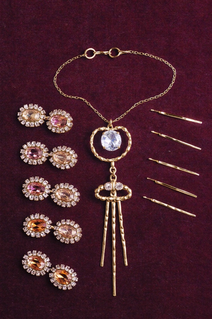 A crystal maang tikka with matching hair pins