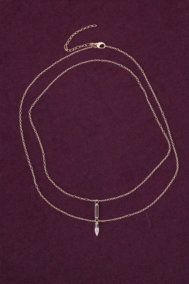 A fine rose-gold chain with a small crystal pendant